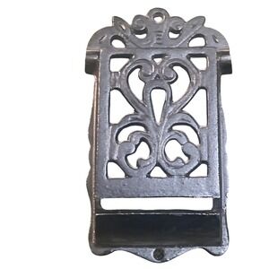 vintage Victorian-style cast iron wall-mounted match holder ornate scrollwork